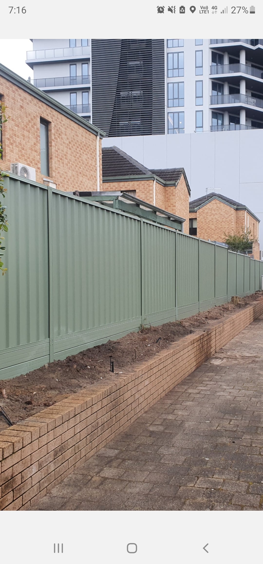 An olive Colorbond fence installed in Perth, featuring sturdy steel panels powder-coated in a rich olive color. The Colorbond fence offers a durable, low maintenance, and stylish solution for defining property boundaries and enhancing security and privacy. The olive color adds a touch of personality to the property and complements the surrounding landscape or house exterior. The fence installation team can customize the design and height of the fence to meet the specific needs and preferences of the property owner, providing a practical and attractive boundary for the property.